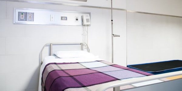 What We Carry Within Empty hospital bed.