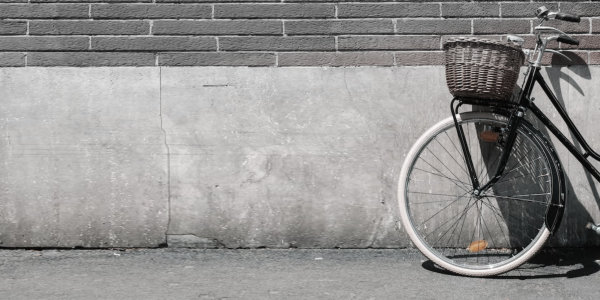 The Lure of a Bicycle Bicycle leaning against wall