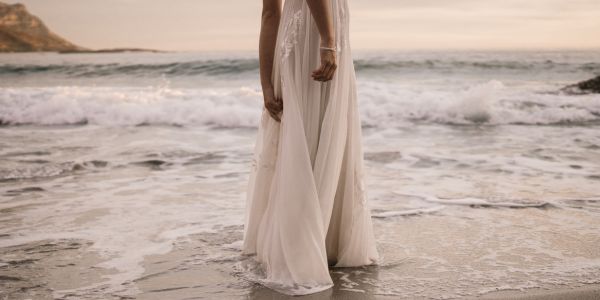 Woman in a white dress on the beach