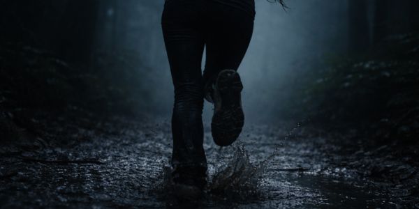 Running through the foggy forest