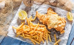 Fresh fish and chips served in paper